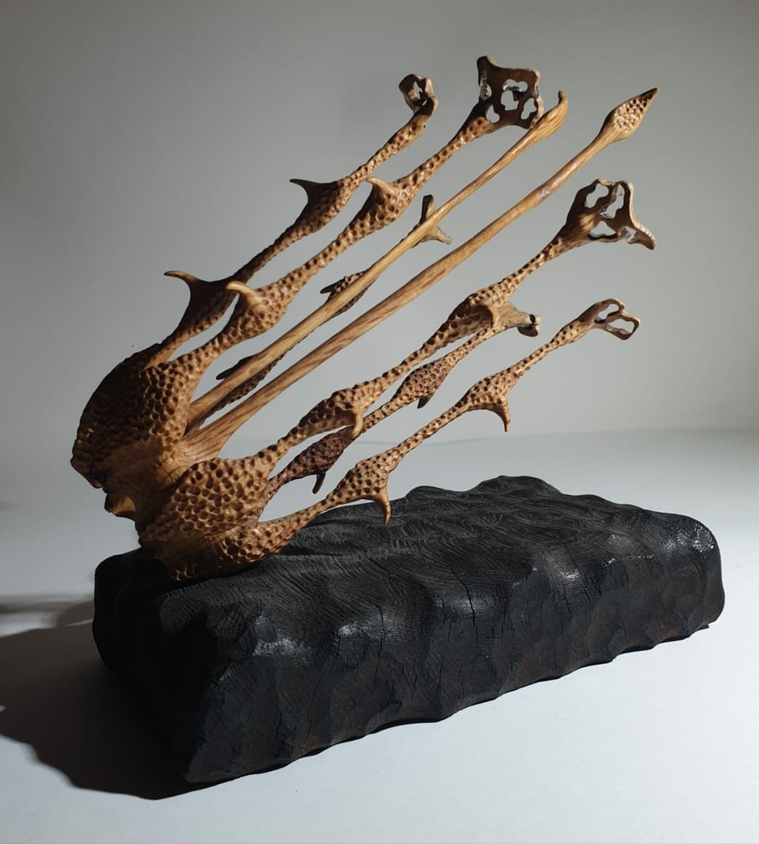 Rear - side view where the carved tentacles can be seen with a thickness of a few millimeters.
