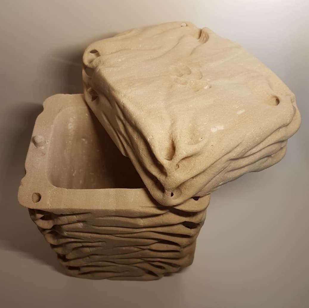 Detail of the "Waves" urn with the lid open.