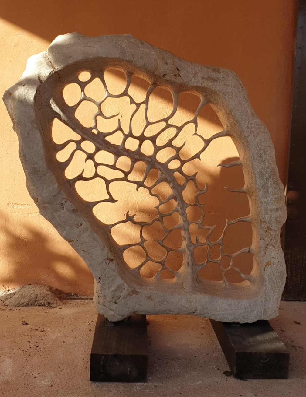 Limestone sculpture in one piece representing the skeleton of an imaginary organism.