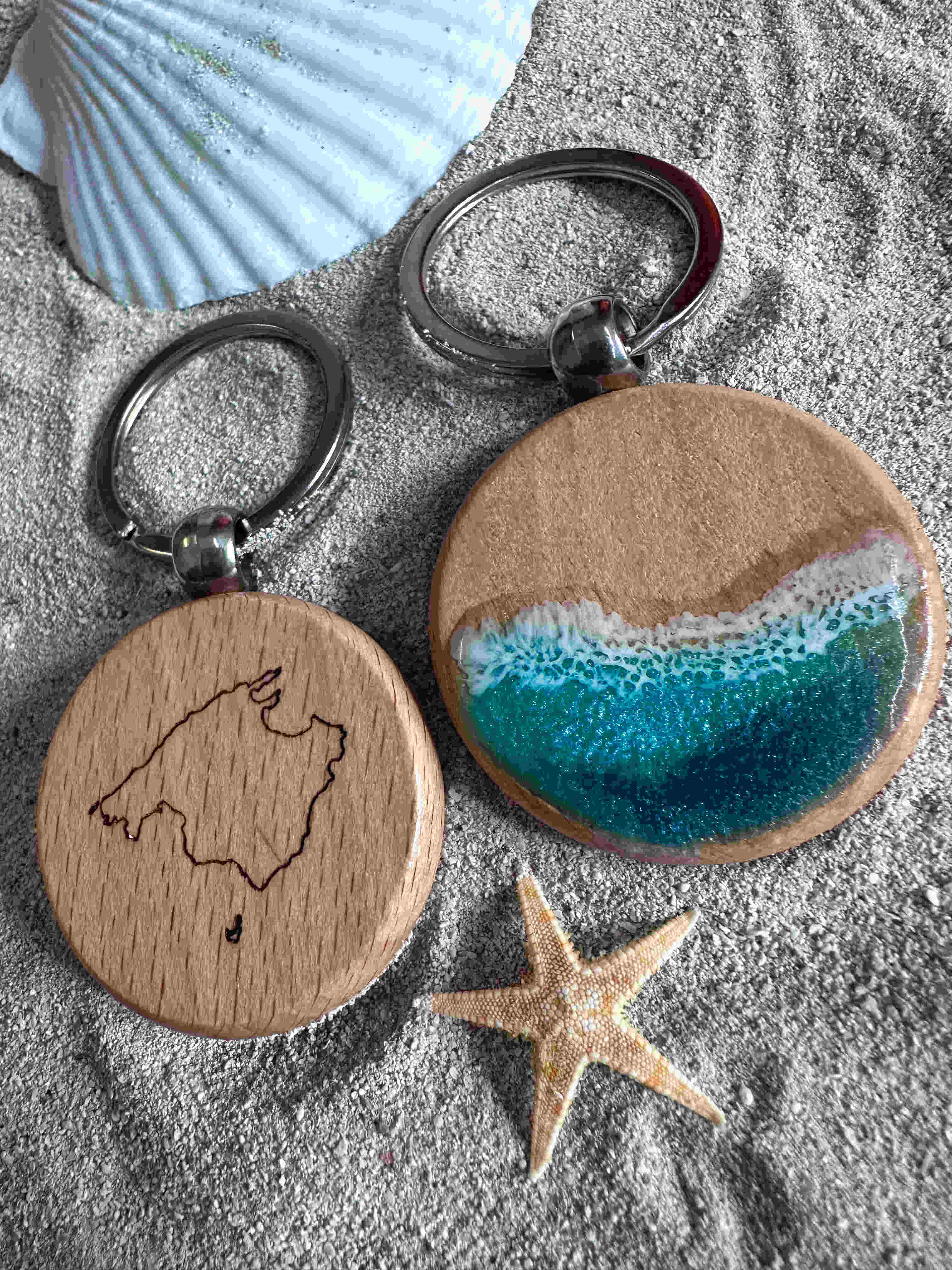 Image of epoxy resin keychain on beach sand