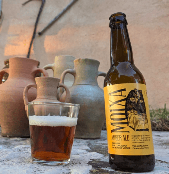 Botellín de Moixa Original y vaso con el producto