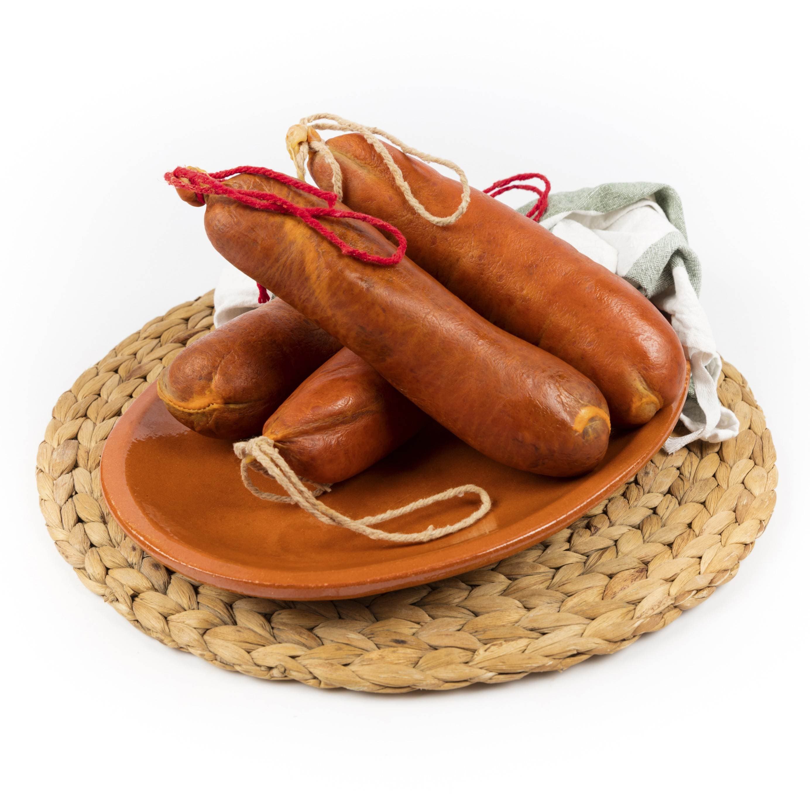 Sobrasada de Mallorca CRISOL made with Duroc pork and cured in natural casing. Traditional product presentation.