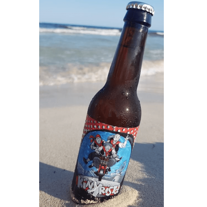 Image of KinKristo Beer on the beach 